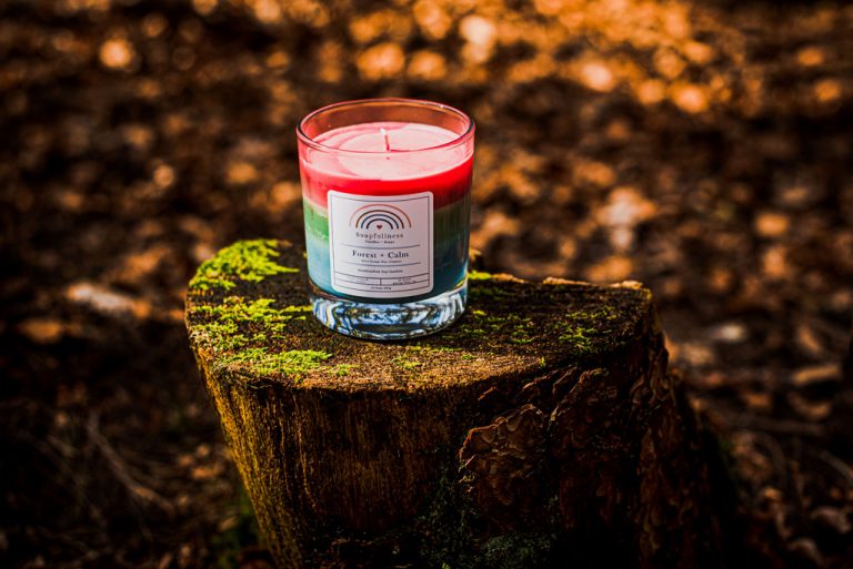 best smelling candle inspired by nature. candle on top of tree stump