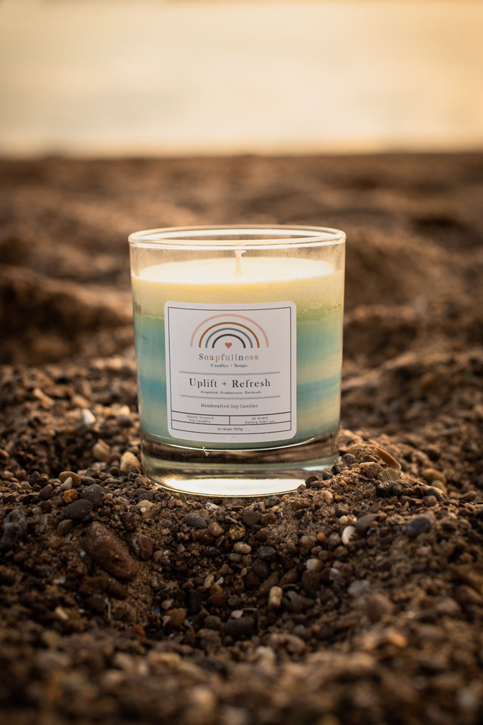 soy candle on the beach