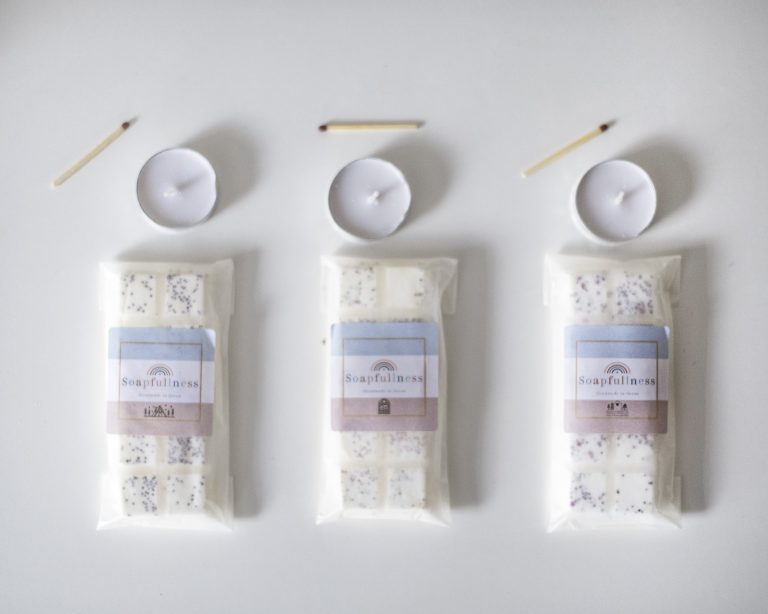 3 wax melt bars with tealights and unused matches above the,