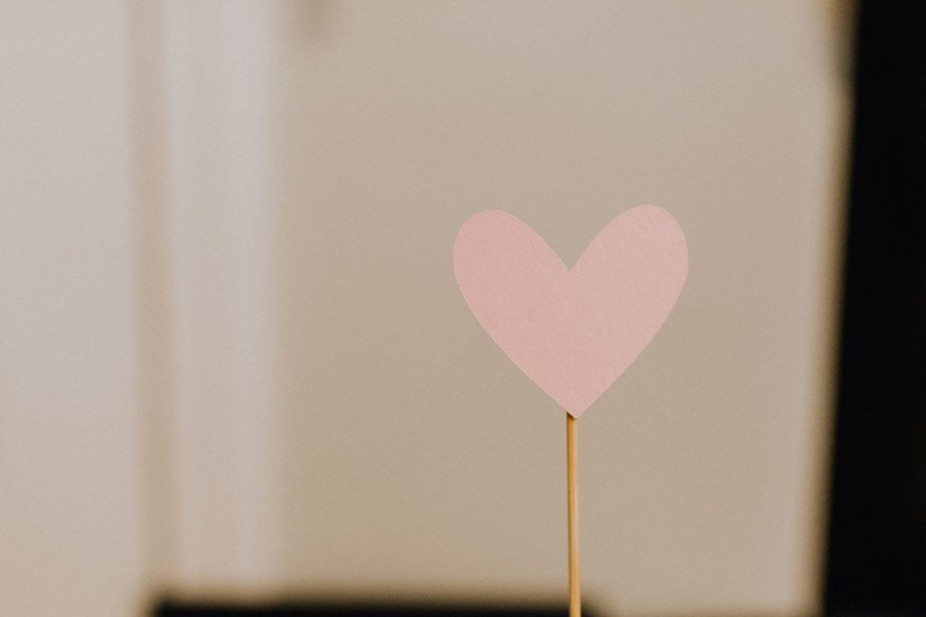 pink love heart on a stick showing self love and self care